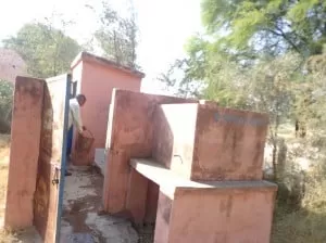 cleaning the toilet in his school